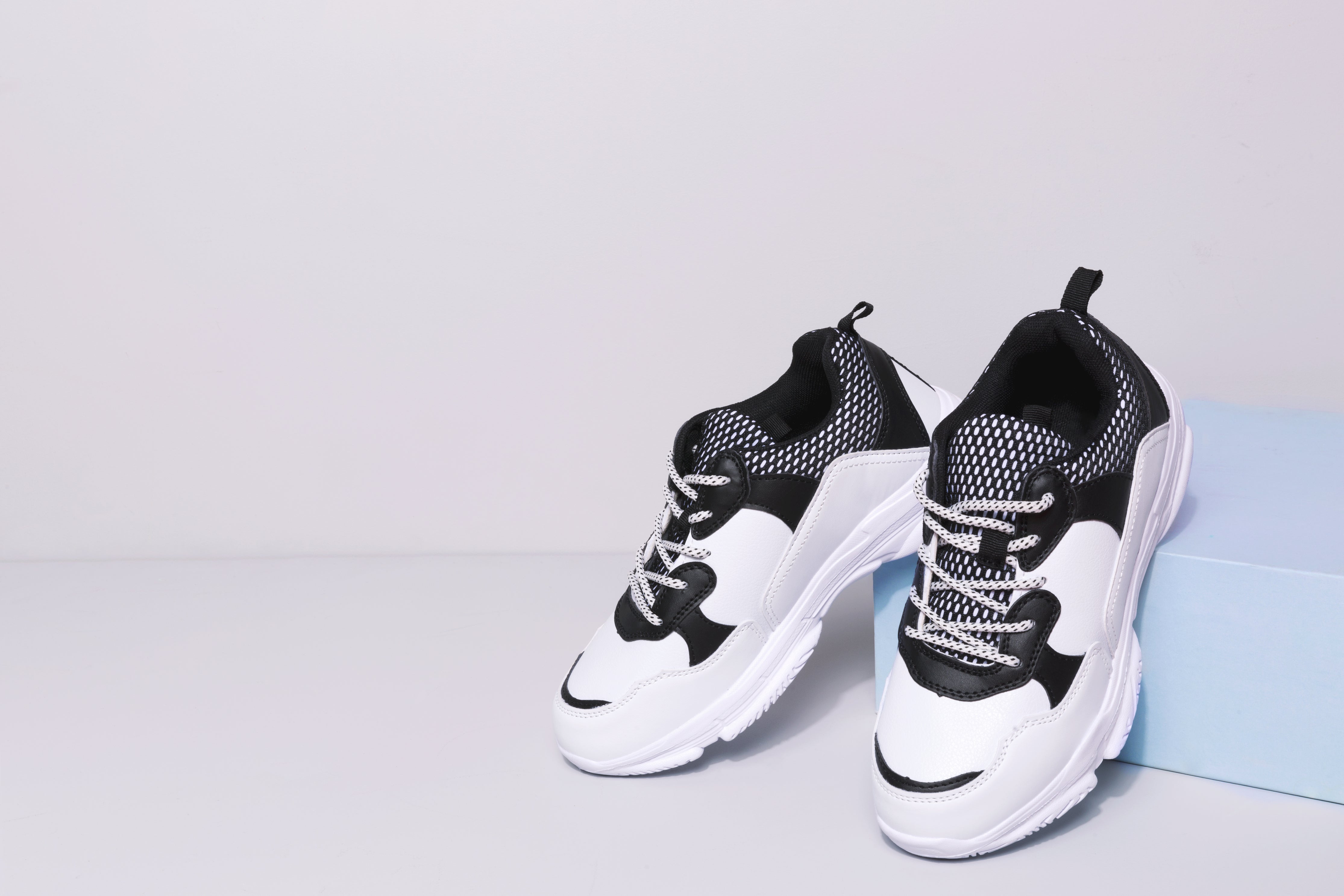 Fashionable Black And White Sneakers
